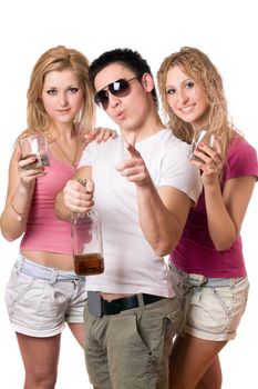 Joyful young people with a bottle of whiskey. Isolated