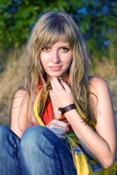 Pretty young woman with yellow bag outdoors