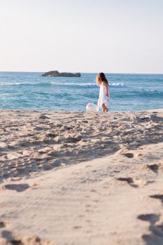 little cute girl smiling playing on beach in summer vacation