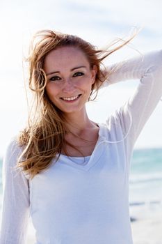 beautiful young woman walking on beach in summer vacation relaxing