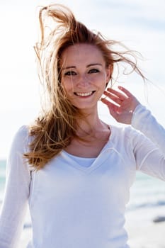 beautiful young woman walking on beach in summer vacation relaxing