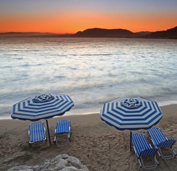 Sunset over Pefkos beach in Rhodes in Greece