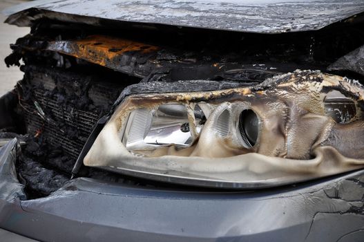 Close up detail of a burnt car in a car accident