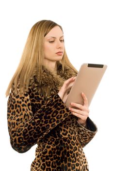 Attractive blonde woman looking at the tablet pc