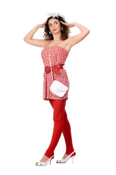 Lovely young woman in dress and red tights. Isolated