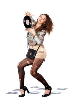 Playful young woman with vinyl disc in a hands