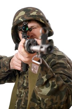 Soldier with a rifle in studio. Isolated