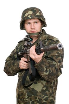 Armed soldier pointing m16 in studio. Upperhalf