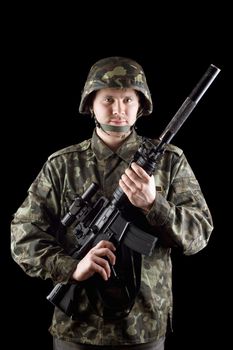 Soldier staying with m16 in studio. Isolated