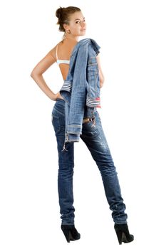 Sexy young woman in a blue denim suit