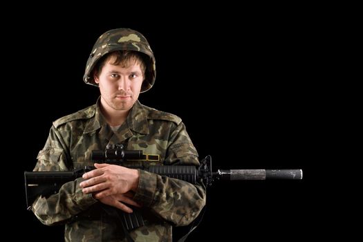 Soldier with a rifle in the hands