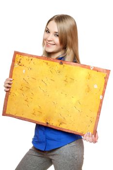 Cheerful young woman posing with yellow vintage board. Isolated