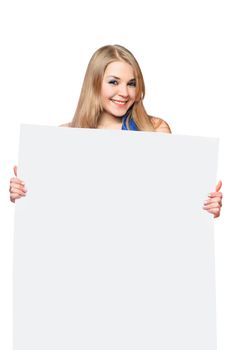 Happy young woman posing with white board. Isolated