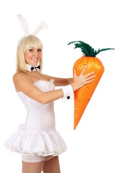 Portrait of sexy young blonde with a carrot