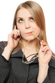 Close-up portrait of thoughtful pretty blonde with phone