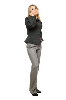 Young woman in a gray business suit talking on the phone