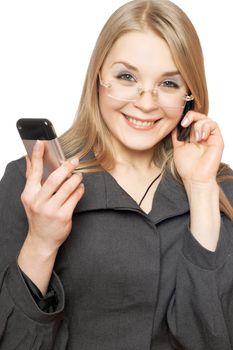 Close-up portrait of cheerful blonde with two phones