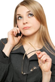 Close-up portrait of thoughtful young blonde with phone