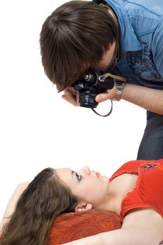 Photographer taking pictures of the young woman
