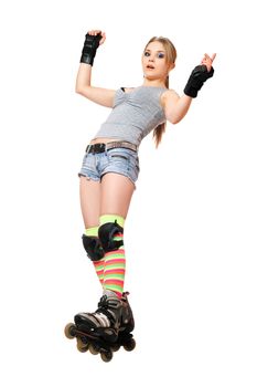 Young woman tries to keep his balance on roller skates