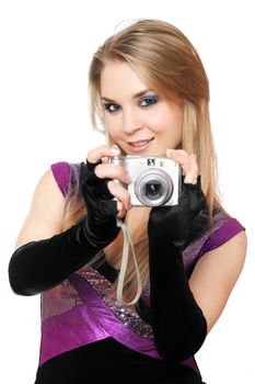 Playful blonde holding a photo camera. Isolated on white