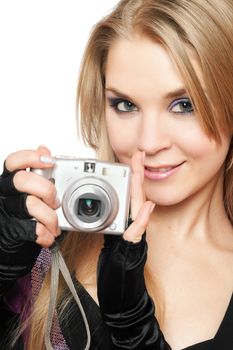 Smiling beautiful blonde holding a photo camera. Isolated