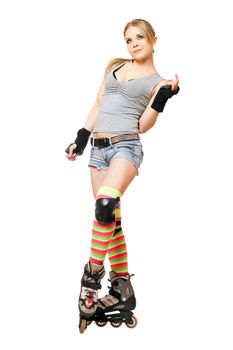 Beautiful young blonde on roller skates. Isolated