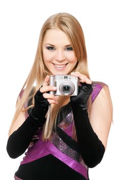 Smiling blonde holding a photo camera. Isolated on white