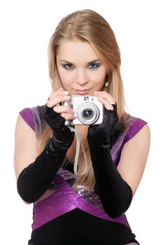 Young attractive blonde holding a photo camera. Isolated on white