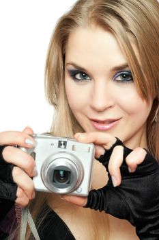 Smiling beautiful woman holding a photo camera. Isolated