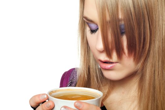 Attractive young blonde with a cup of hot tea
