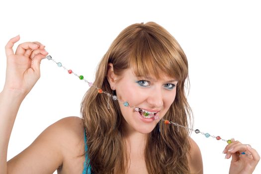 Portrait of the young beautiful woman with a beads in a teeth. Isolated