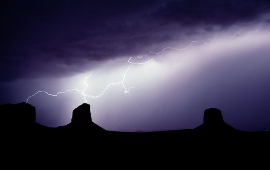 Lightning hits the buttes in Monument Valley