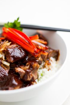 Japanese Steak Bowl with rice on white bowl and chopstick