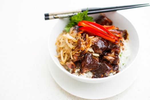 Japanese Steak Bowl with rice on white bowl and chopstick