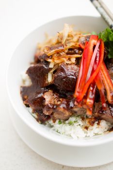 Japanese Steak Bowl with rice on white bowl and chopstick