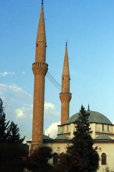 Mosque with a two high towers against blue sky