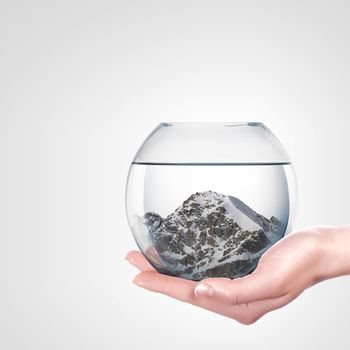 Beautiful snow-capped mountains inside a glass bowl