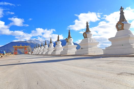 China. Yunnan. Shangri-La region. Dequin, called Shangri-La. Way to Dequin, on the Tibetan Border.Buddhist Stupa. On the Background the Meili Snow Mountain Peack.