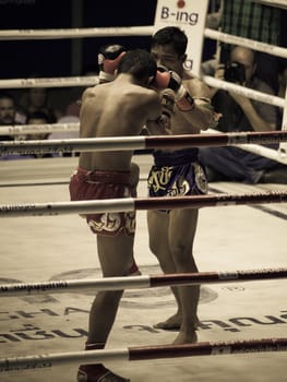 BANGKOK, THAILAND- OCTOBER 04 : Unidentified boxers compete in Thai Fight: Muay Thai Charity on October 04, 2012 at Rajadamnern Stadium in Bangkok, Thailand