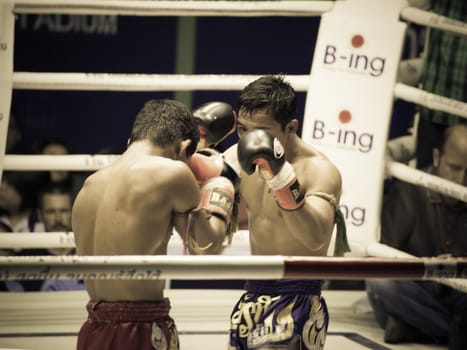 BANGKOK, THAILAND- OCTOBER 04 : Unidentified boxers compete in Thai Fight: Muay Thai Charity on October 04, 2012 at Rajadamnern Stadium in Bangkok, Thailand