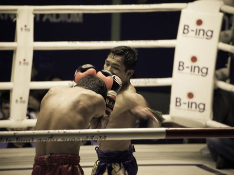 BANGKOK, THAILAND- OCTOBER 04 : Unidentified boxers compete in Thai Fight: Muay Thai Charity on October 04, 2012 at Rajadamnern Stadium in Bangkok, Thailand