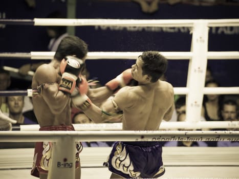 BANGKOK, THAILAND- OCTOBER 04 : Unidentified boxers compete in Thai Fight: Muay Thai Charity on October 04, 2012 at Rajadamnern Stadium in Bangkok, Thailand