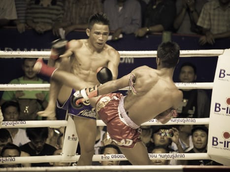 BANGKOK, THAILAND- OCTOBER 04 : Unidentified boxers compete in Thai Fight: Muay Thai Charity on October 04, 2012 at Rajadamnern Stadium in Bangkok, Thailand