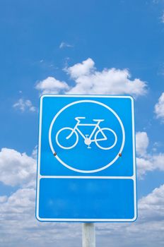 roadsign bicycle under cloudy sky