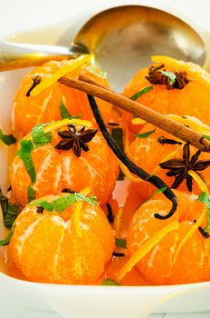 Mandarins in spiced syrup with cinnamon, star anise, vanilla and fresh mint