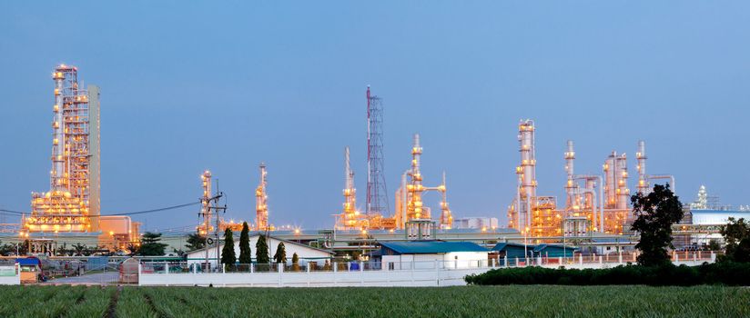 Panorama Architecture of Oil Refinery Plant with distillation tower at dusk