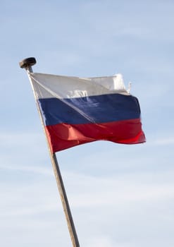 old dirty russian flag in the wind