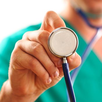 Doctor holding stethoscope (with shallow depth of field)