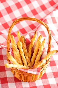 Cheese twists pastry over red cloth
